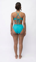 Turquoise Swimsuit with cut offsides Available in Size M
