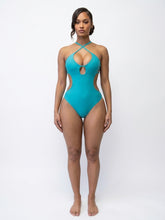 Turquoise Swimsuit with cut offsides Available in Size M