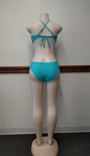 Turquoise Swimsuit with cut offsides Available in Size M